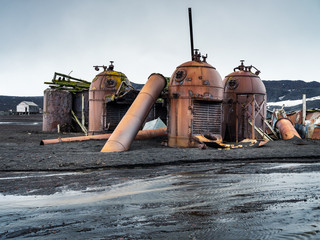 ruins of old equiplment of whale plant in Antarctica - obrazy, fototapety, plakaty