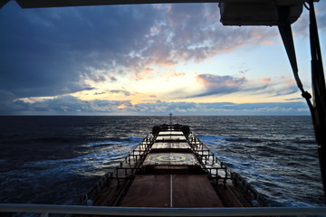 View of the sunset from the ship underway and in the port. Colorful views of the surface of the...
