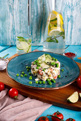 Olivier salad in a plate on the table