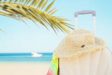 White suitcase on sea backround, Concept of summer traveling © VAlekStudio 