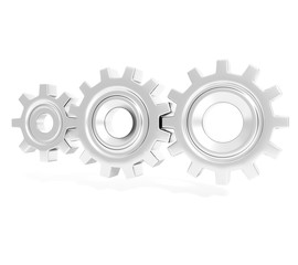 Three connecting metallic gear cogs of different sizes isolated on white background; close up, perspective view 3d rendering, 3d illustration
