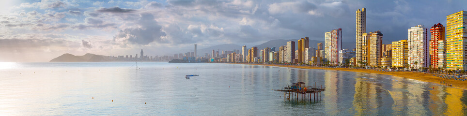Fototapeta premium Рanoramic seascape view of summer resort with beach(Playa de Llevant) and famous skyscrapers. Costa Blanca. City of Benidorm, Alicante, Valencia, Spain.