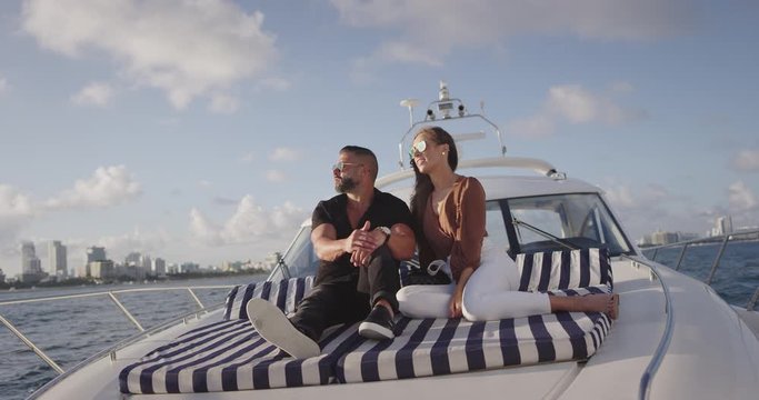 Couple relaxing on yacht in ocean