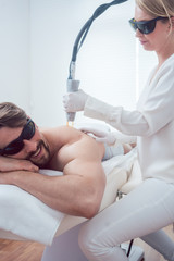 Man in a hair removal studio