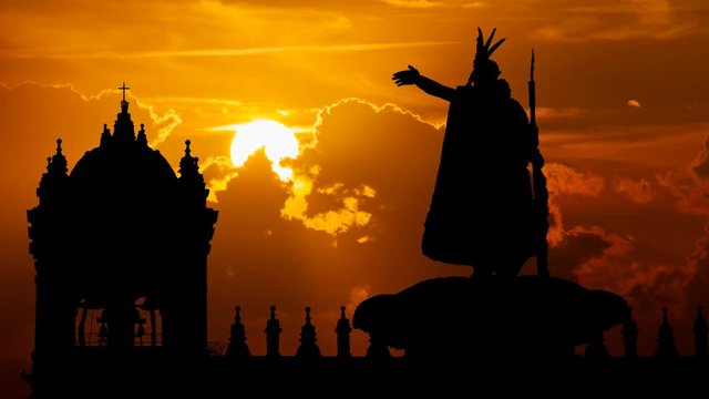 Inca King Pachacutec Statue in Plaza de Armas, Time Lapse at Sunset with Red Clouds and Fiery Sky, Cusco, Peru
