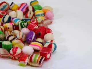 candies in different colors on a white background