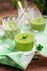 Cream of Green Pea Soup Garnished with Fresh Peas