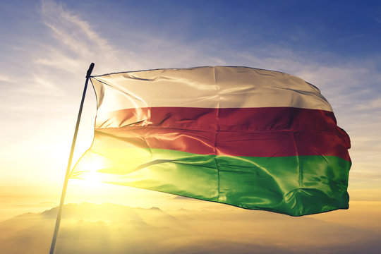 Sincelejo of Colombia flag waving on the top sunrise mist fog