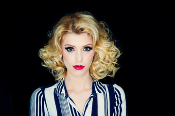 Pin up woman portrait. Beautiful retro female with red lips and old fashion hairstyle.