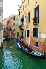 Fototapeta na wymiar Canal with bridge in Venice, Italy. Architecture and landmark of Venice. Cozy cityscape of Venice.