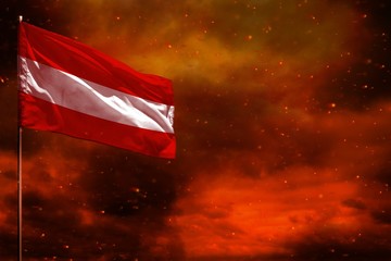 Fluttering Austria flag mockup with blank space for your text on crimson red sky with smoke pillars background. Troubles concept.