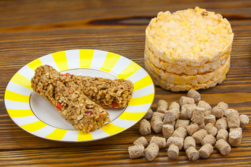 Crispy appetizing bread with strawberries on a plate on  wooden background