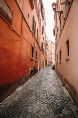 Old beautiful empty narrow streets in small city of Lucca in Italy