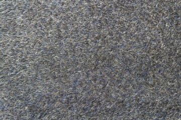Grey wool fabric background. Amazing texture of warm textile for winter coats.