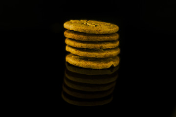 Medical Cannabis Seeds and CBD Cannabis Cookies on the black mirroring background.