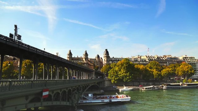 Tour boat passes under Bik Harem Bridge in Paris 