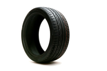 car tire with directional rotation isolated on a white background. new modern low profile car tyre. 