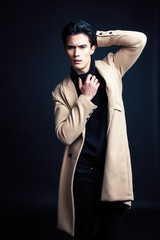 Obraz premium handsome asian fashion looking man posing in studio on black background, lifestyle modern people concept