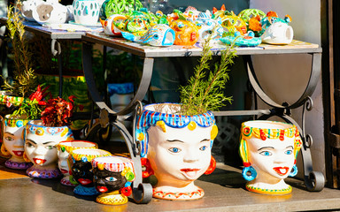 Colorful traditional ceramics vases at Positano store reflex