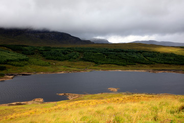 Fototapeta na wymiar Skye Island (Scotland), UK - August 15, 2018: Typical landscape of Scotland, Isle of Skye, Inner Hebrides, Scotland, United Kingdom