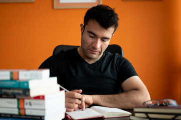 happy man therapist in him office with books