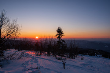 sunrise sun in winter in mountains, Czech Beskydy