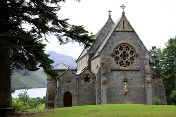 Fototapeta na wymiar Skye Island (Scotland), UK - August 15, 2018: View of Loch Shiel and St Mary St Finnan's Church, Inner Hebrides, Scotland, United Kingdom