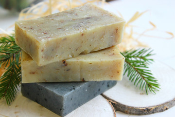 Natural handmade soap on a wooden background. Spa-natural treatments.Natural organic soap from scratch with pine aroma, essential oils.
