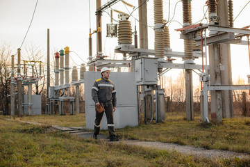 The energy engineer inspects the equipment of the substation. Power engineering. Industry