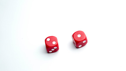 Two dice with one and two count against white background