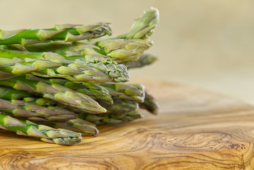 Fresh Young Asparagus closeup. Asparagus on wood board