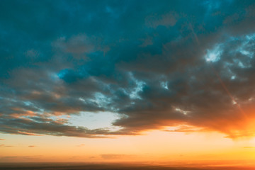 Fototapeta na wymiar Sunrise Bright Dramatic Sky. Scenic Colorful Sky At Sunset Dawn