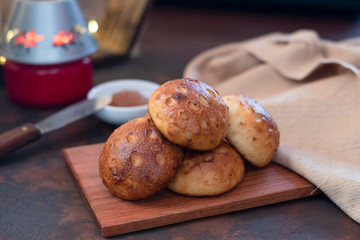 Homemade bread on wooden board with jam background