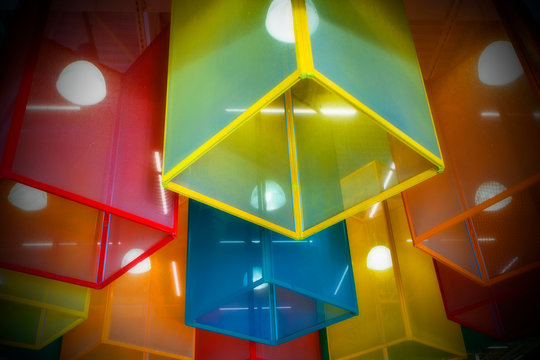 Colored lamps. Unusual background on the ceiling.