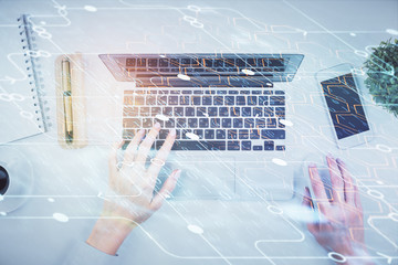 Double exposure of woman hands working on computer and data theme hologram drawing. Top View....
