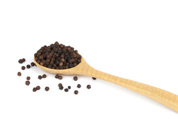 Black peppercorns (Black pepper) in wooden spoon isolated on white background.