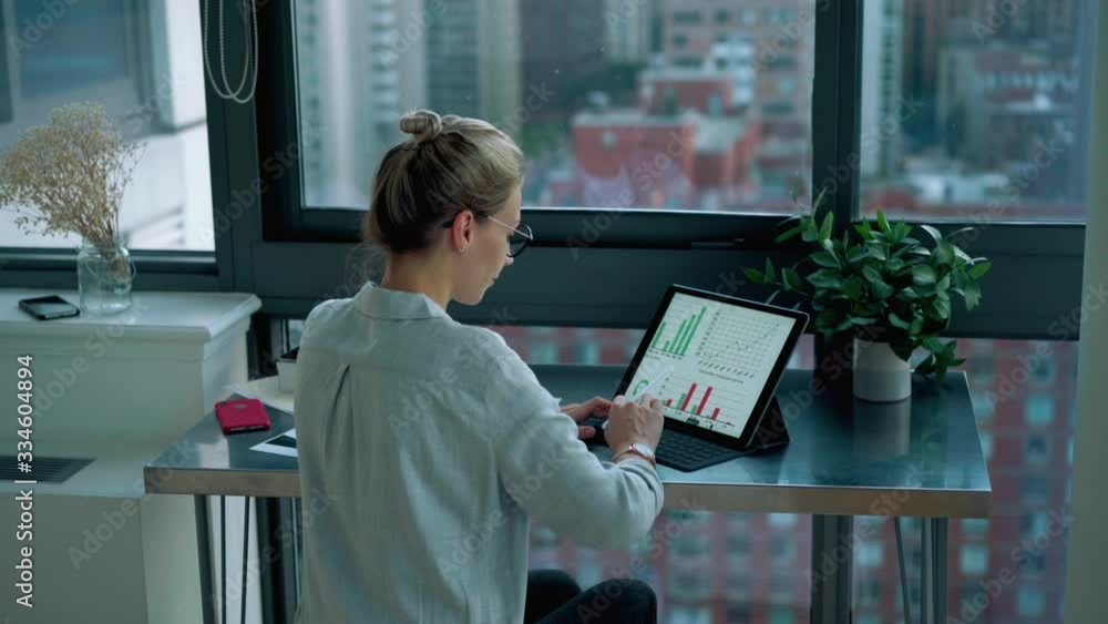 Poster millennial female professional checking online information from statistic graphs about bitcoin excha