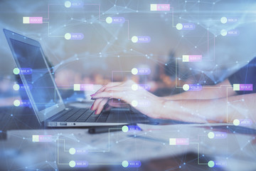 Multi exposure of woman hands working on computer and data theme hologram drawing. Tech concept.