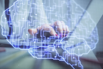 Multi exposure of woman hands working on computer and human brain hologram drawing. Ai tech concept.