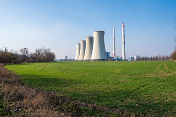 Fototapeta na wymiar coal power plant with green field around, czech detmarovice 04.01.2020