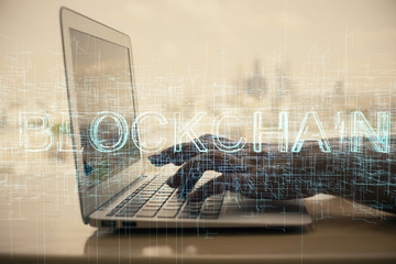 Double exposure of woman hands typing on computer and crypto market theme hologram drawing. Blockchain concept.