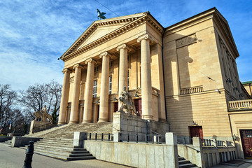 Fototapeta premium stone statues and classicist facade of an Opera building in the city of Poznan.