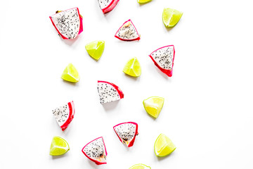 Tropical fruit design on white table background top view space for text