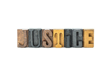 Justice in wood block letters