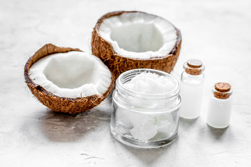 coconut oil for body care in cosmetic concept on white desk