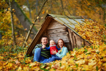 happy family in the autumn forest