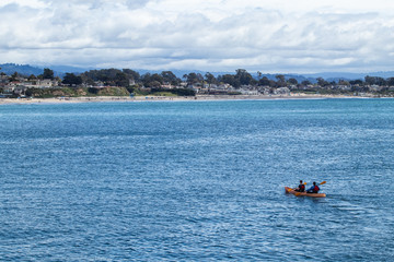 Two Men Kayaking to Beach