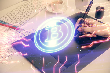 Double exposure of blockchain business sketch hologram and woman holding and using a mobile device.