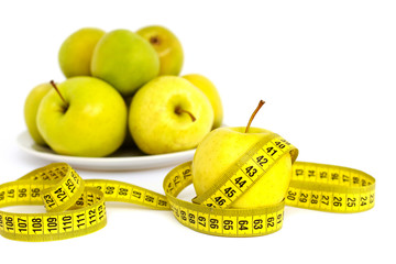 Measuring tape and fresh apples. Diet, healthy eating, food and weigh loss concept.