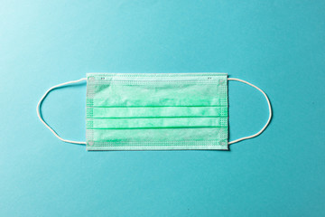 Medical protective mask on  background. Disposable surgical face mask cover the mouth and nose.